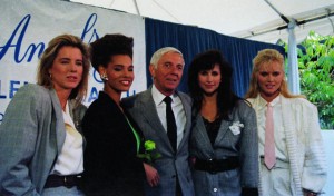 05 May 1988, Los Angeles, California, USA --- Original caption: Hollywood: Aaron Spelling joins his Angels '88 cast members as he announces that the most extensive talent search ever conducted is over. Some 20,000 women were interviewed for the roles before, (L-R) Tea Leoni, Sandra Canning, Karen Kopins and Claire Yarlett were given the parts. It was Spelling who brought Charlie's Angels to the TV in the late '70's. --- Image by © Bettmann/CORBIS
